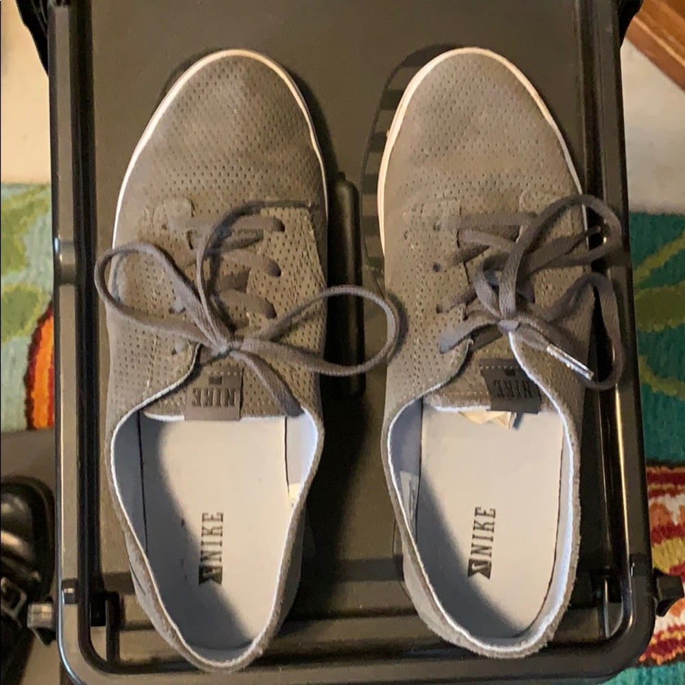 Gray suede Nike lace up shoes.